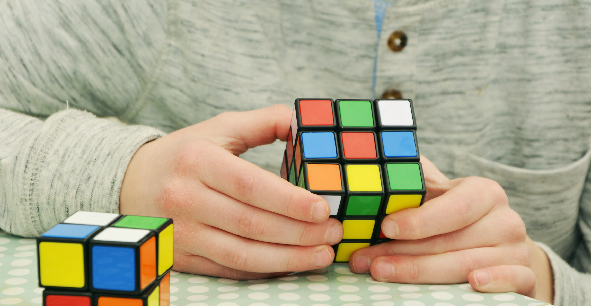 Hands Holding Rubik Cube
